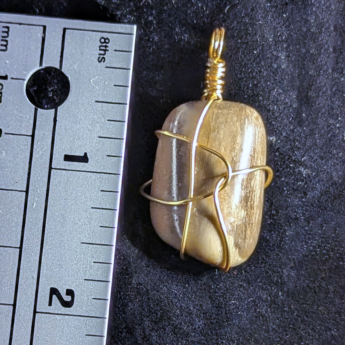 Wire-wrapped pendant with polished petrified wood